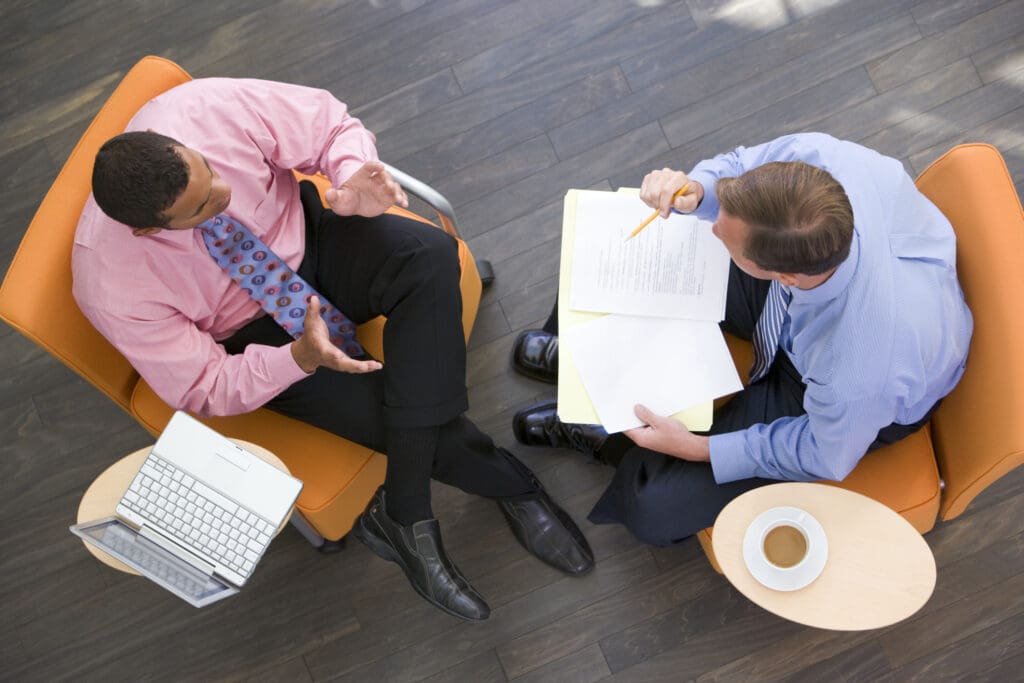 A top down view of two businessmen collaborating